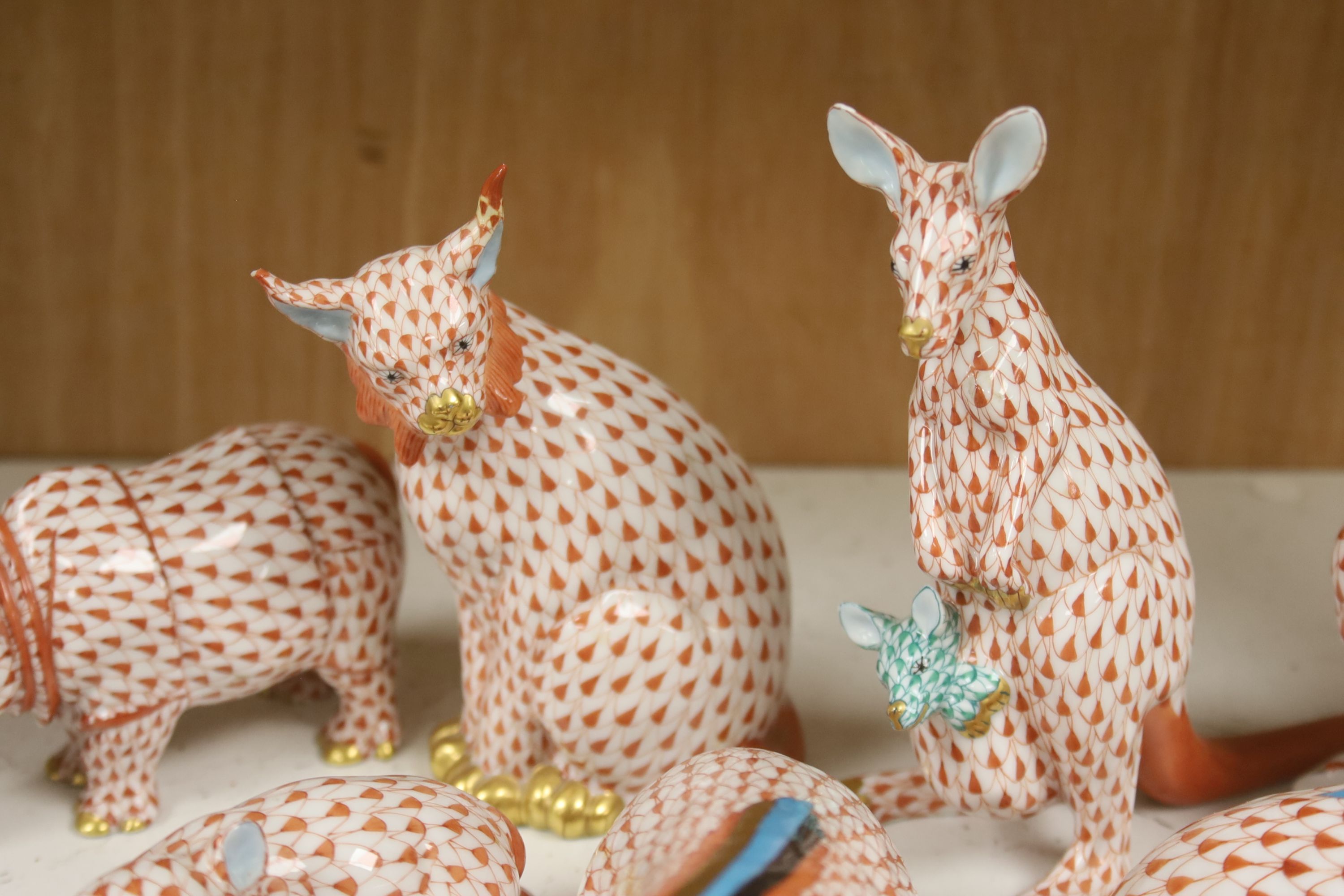 Nine Herend red ‘fishnet’ porcelain animal and bird figures,